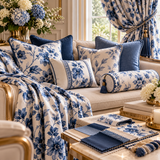 Luxury blue and white floral soft furnishings featuring custom cushions, decorative bolster pillows, coordinated drapery and fabric swatches.